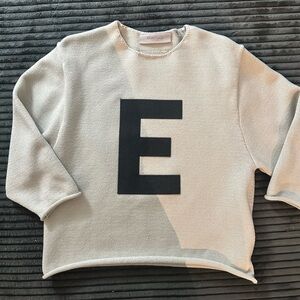Essentials Cream Crewneck Sweater with Black 'E' Graphic
